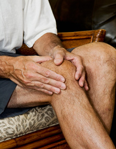 Image of man massaging arthritis pain