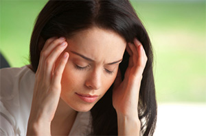 Image of a woman with a headache.